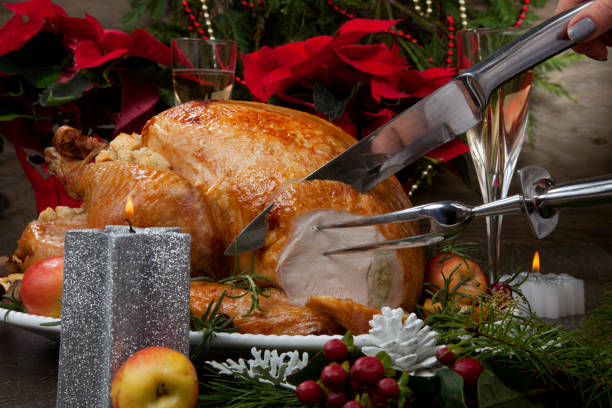 istock Carving Roasted Christmas Turkey with Grab Apples 1189789814