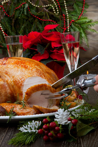 istock Carving Roasted Christmas Turkey with Grab Apples 1189789839