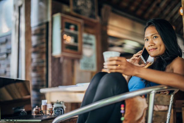 istock Beautiful woman talking on phone 1189791293