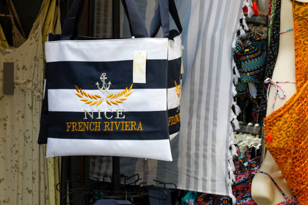 Nice, France - September 17, 2018: Outdoor store and on the stand there is a shopping bag with an inscription reminiscent of a place worth remembering.