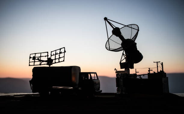 istock Satellite dishes or radio antennas against evening sky. Selective focus 1189796475