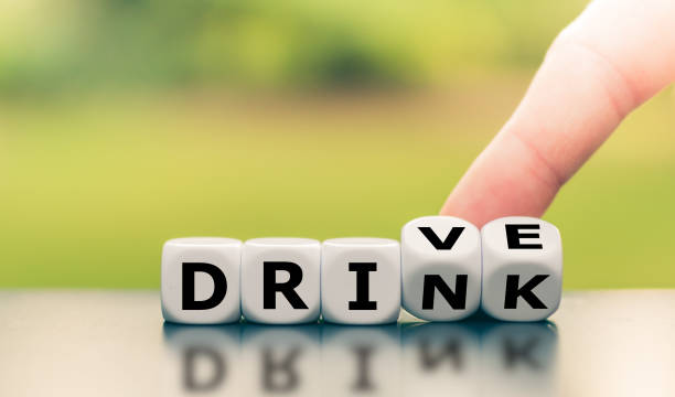 istock Drink or drive? Hand turns dice and changes the word 