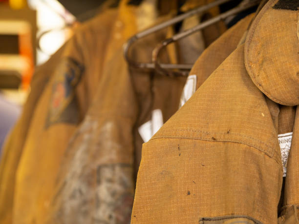 istock Rack of firemen's coats 1189799026