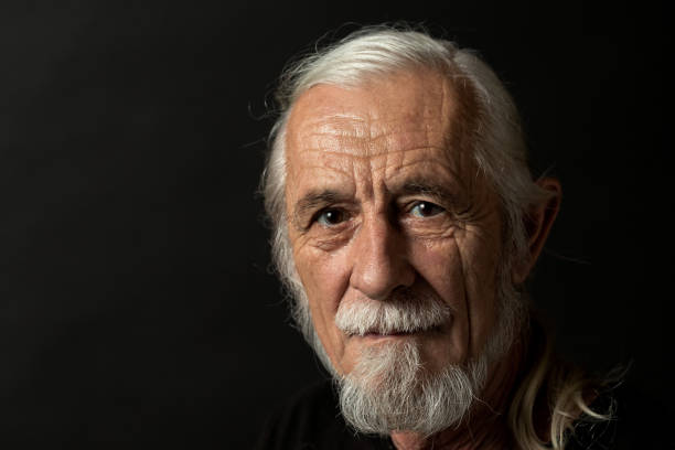 istock Low key studio portrait of old man closeup 1189799282