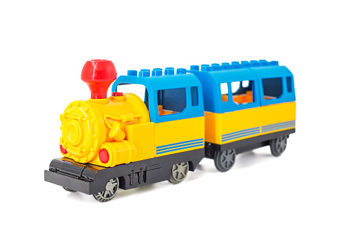 Tren de juguete aislado sobre el fondo blanco. Colorido tren de juguete aislado sobre fondo blanco. photo