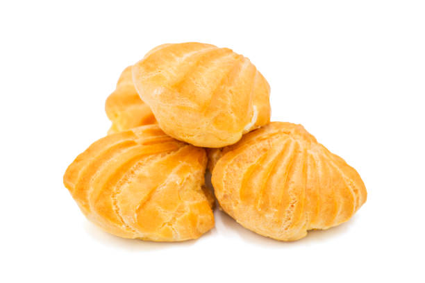 istock Profiteroles, close-up. Puffs cakes filled with pastry cream. Confectionery, eclair on a white background. 1189799332