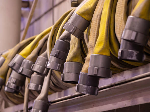istock Row of coiled fire hoses 1189800227