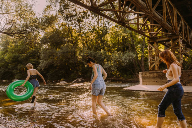 istock Amazing day with girlfriends on the river 1189800269