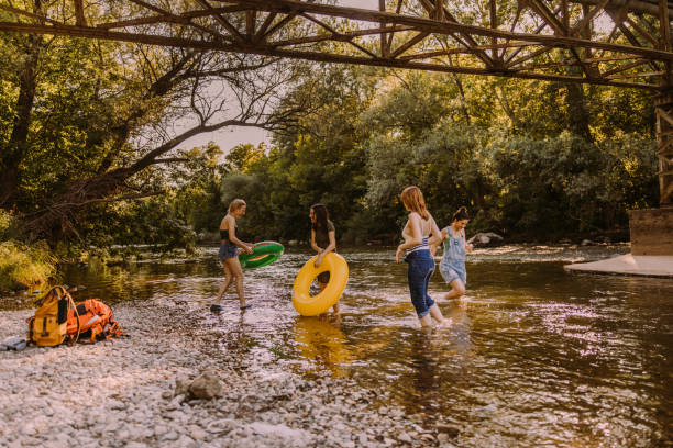 istock Amazing day with girlfriends on the river 1189800270