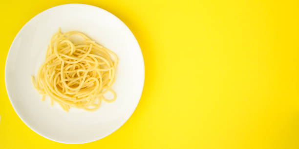 istock pasta, spaghetti or bucatini (ingredients, serving portion of food ). menu concept. food background. copy space. Top view 1189800546