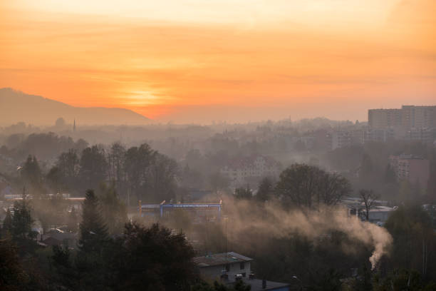 City skyline covered in a dense smog and pollution at sunset. Signboard translation: \