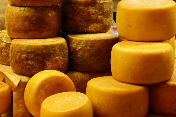istock wheels of cheese 1189802991