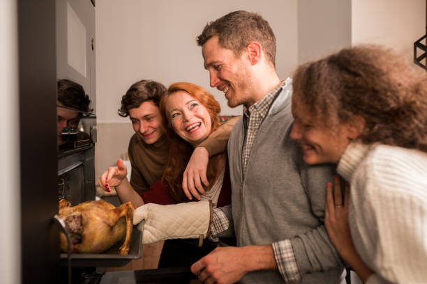 istock Family having fun in the kitchen for Thanksgiving 1189803419