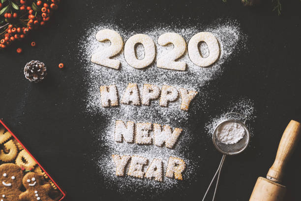 istock Powdered sugar cookies, New year 2020 concept table top shot 1189804585