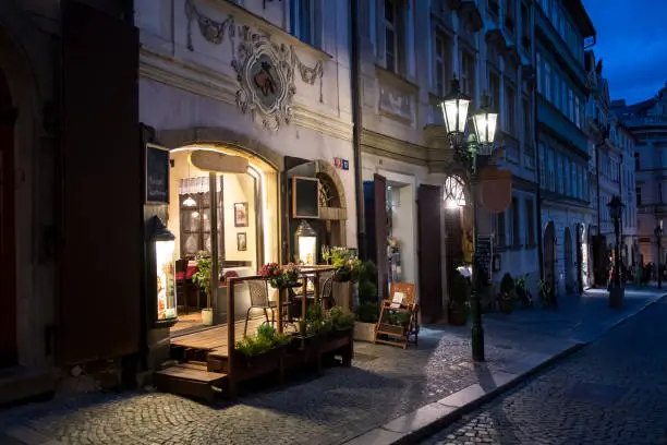 Picturesque Restaurant Illuminated By Streetlamp Lanterns In The Streets Of Prague In The Czech Republic