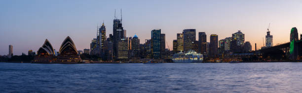 Downtown Sydney and Sydney Opera House panorama at dusk, as seen from Kirribilli