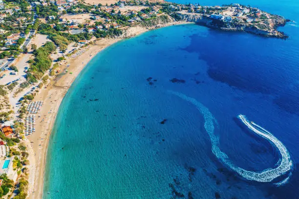 Coral Bay Beach Aerial View. Famous Cyprus beautiful coastline with azure Mediterranean sea water and sandy beach, drone shot.