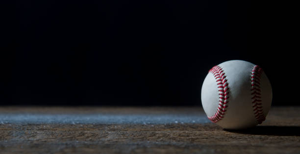 Baseball Ball On Wooden Table. Team sport Baseball Ball On Wooden Table. Team sport base sports equipment photos stock pictures, royalty-free photos & images
