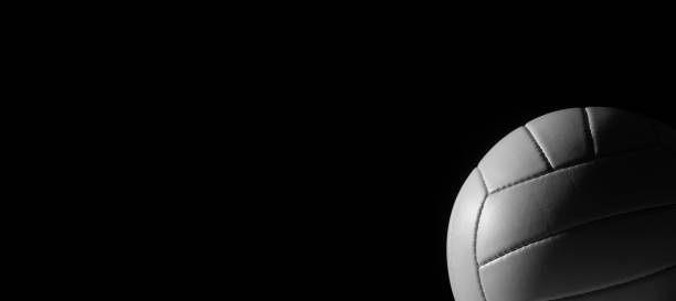 istock White leather volleyball detail on black background 1189809149