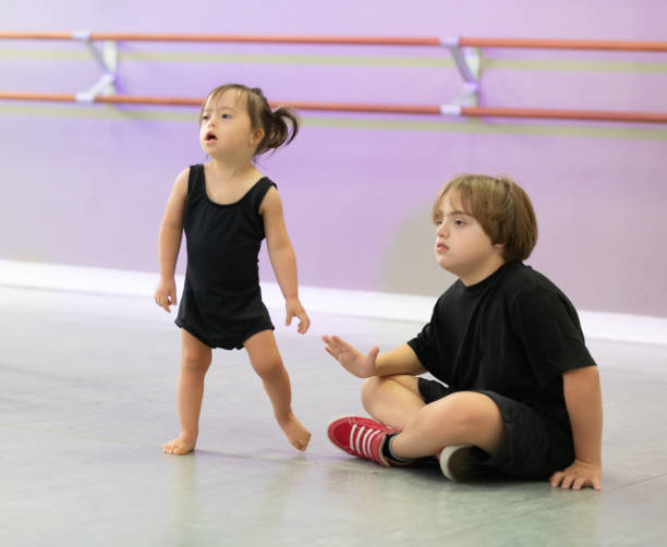 istock Kids Down Syndrome dance studio class therapy 1189811660