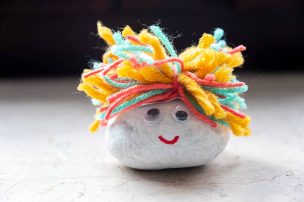 istock Cute Fluffy Cute Rock Smilie Face 1189814088
