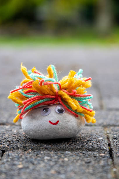 istock Cute Fluffy Cute Rock Smilie Face 1189814092
