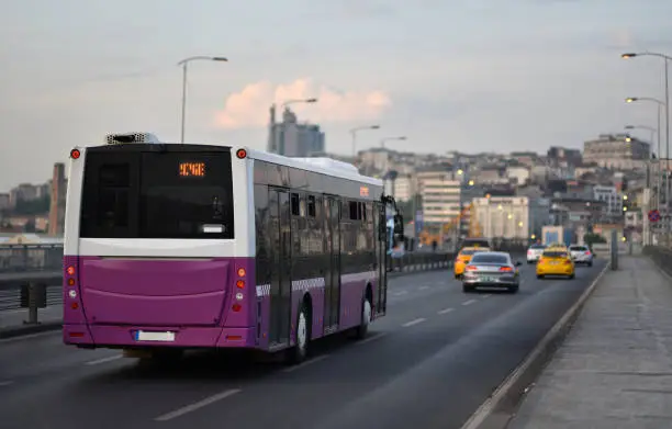 Photo of Evening cItyscape scene with public route bus