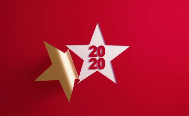 istock 2020 Concept- A Golden Star Shape Folding on Red Background 1189818322