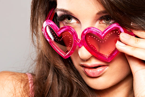 istock Girl with heart shaped sunglasses 118981963