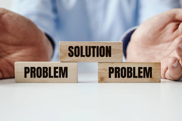 istock Hand holding a wooden jigsaw puzzle with conflict and Solution word. There is a matching puzzle next to it. The concept of solving problems, all problems can be solved, connection. 1189821167