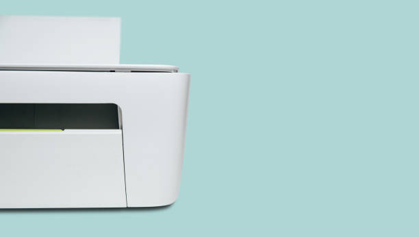 Half of the white printer on a bright, pastel blue background.