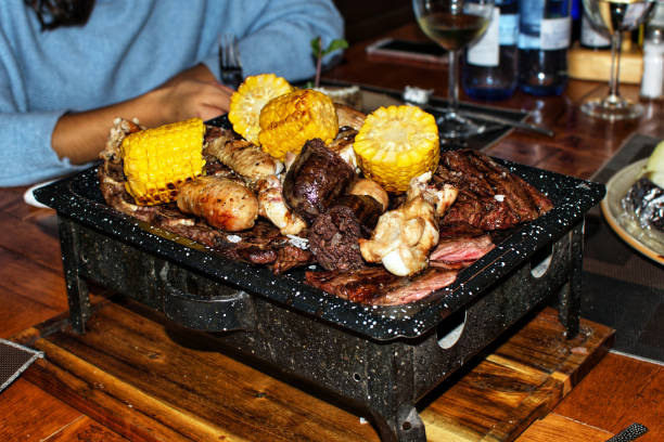 mixtures of barbecue meats parrillada argentinean style. argentinian restaurant specialized in every kind of meats. - red meat meat dish grilled rare imagens e fotografias de stock