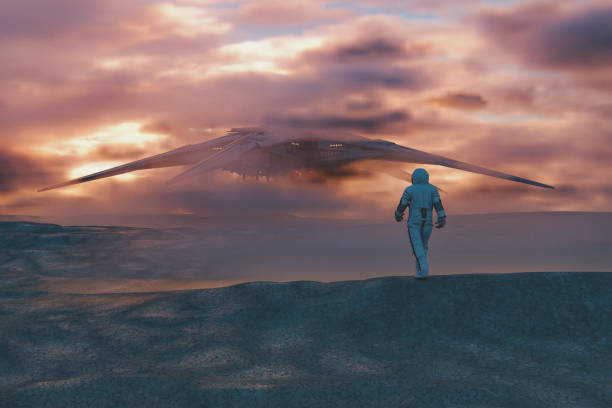 istock Astronaut walking towards UFO on exo planet surface 1189824560