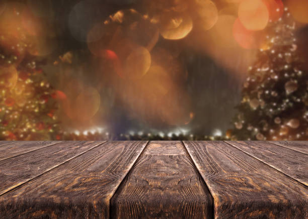 istock Wooden desk on bokeh blur abstract christmas background 1189827208