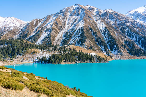 istock Lake with turquoise water surrounded by a mountain massif 1189828598