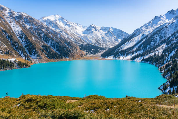 istock Lake with turquoise water surrounded by a mountain massif 1189828606