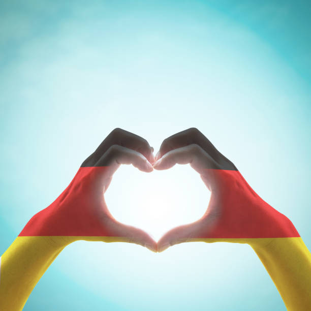 istock Germany national flag on people heart shape hands. 1189828821