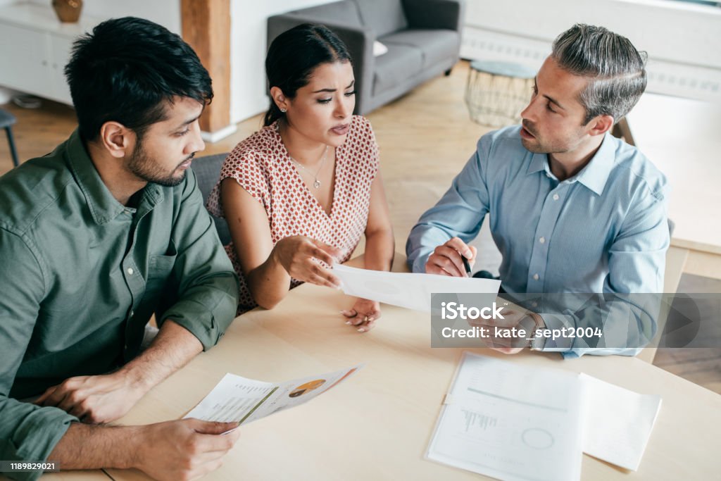 Agreement and  discussion People around the table Customer Stock Photo