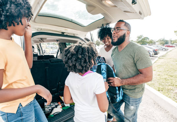 istock Dad  driving children to school 1189829051