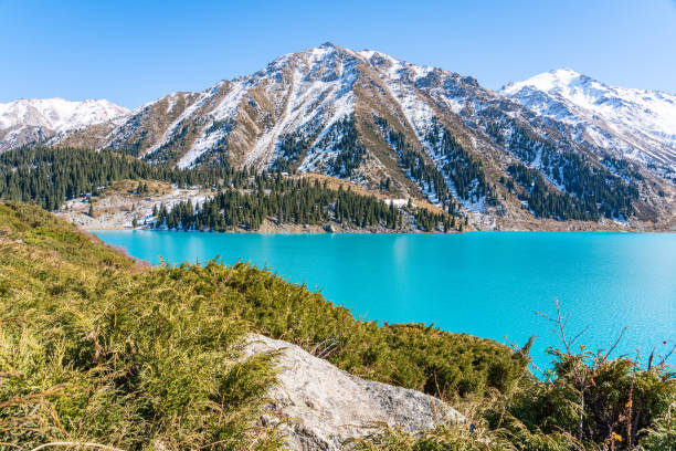 istock Lake with turquoise water surrounded by a mountain massif 1189830816