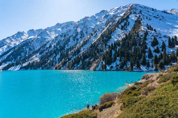 istock Lake with turquoise water surrounded by a mountain massif 1189830902