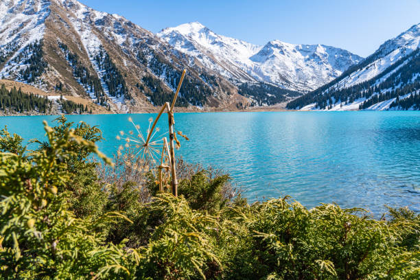 istock Lake with turquoise water surrounded by a mountain massif 1189831066