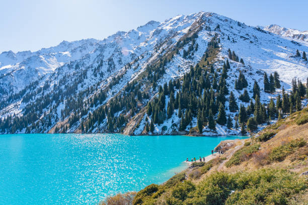 istock Lake with turquoise water surrounded by a mountain massif 1189831083
