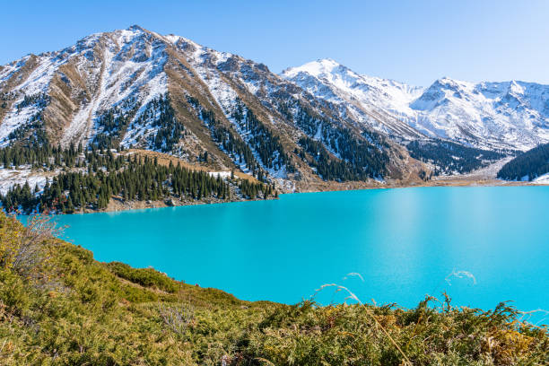 istock Lake with turquoise water surrounded by a mountain massif 1189831151
