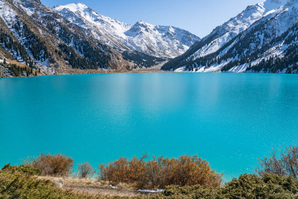 istock Lake with turquoise water surrounded by a mountain massif 1189831207