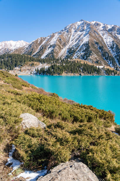 istock Lake with turquoise water surrounded by a mountain massif 1189831784