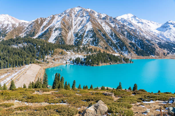 istock Lake with turquoise water surrounded by a mountain massif 1189831787