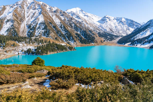 istock Lake with turquoise water surrounded by a mountain massif 1189831856