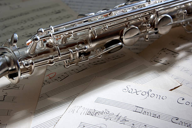 Saxophone and old sheet music stock photo