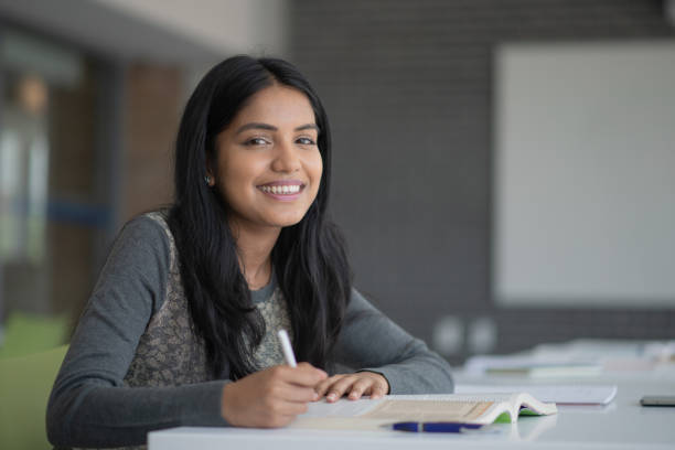 istock Attractive University Student Working on Homework stock photo 1189837621